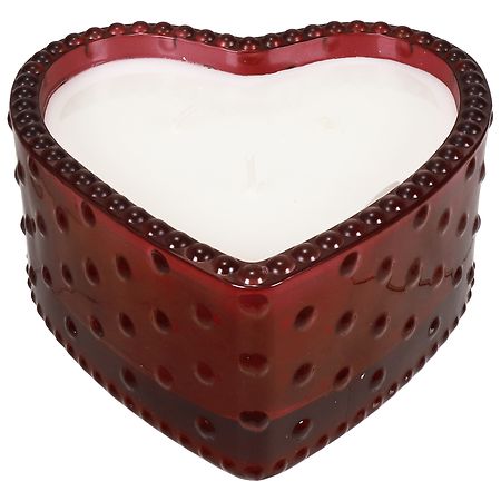 Close-up shot of three beautiful colourful heart-shaped candles